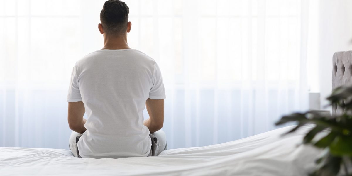 man struggling with erectile dysfunction (ED) and low testosterone levels, thinking about testosterone replacement therapy (TRT) for ED